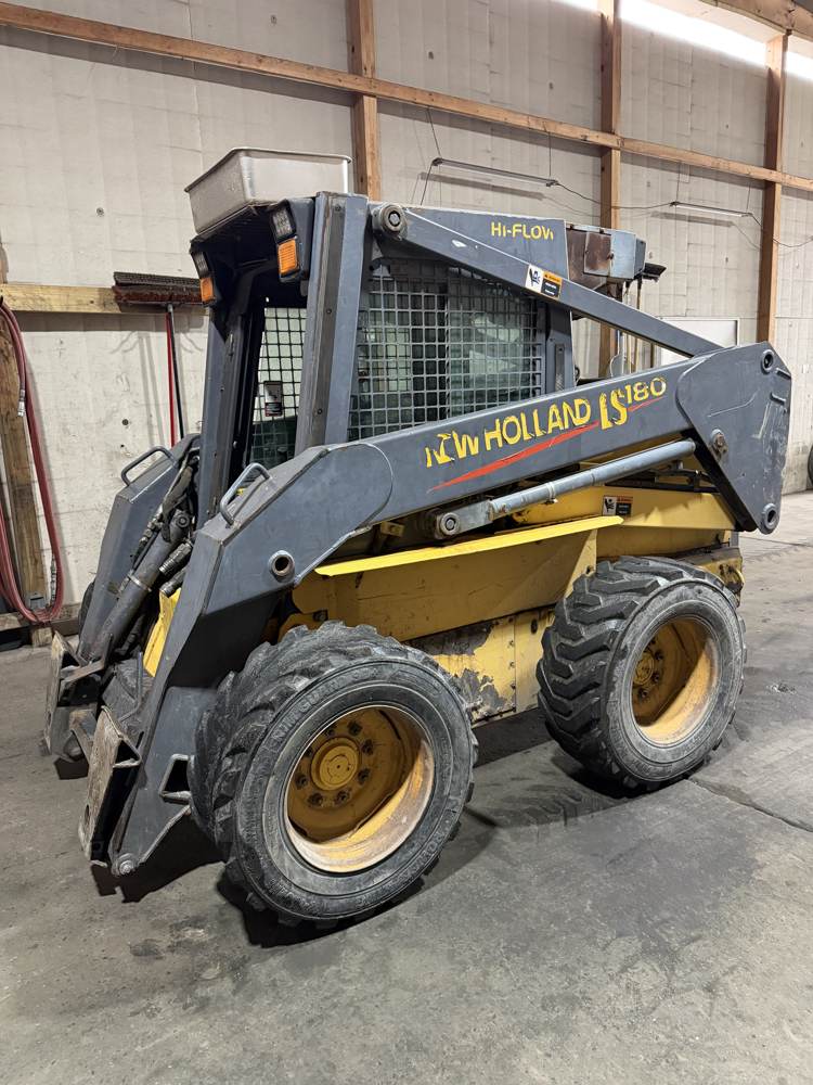 New Holland skid steer serviced for commercial tires