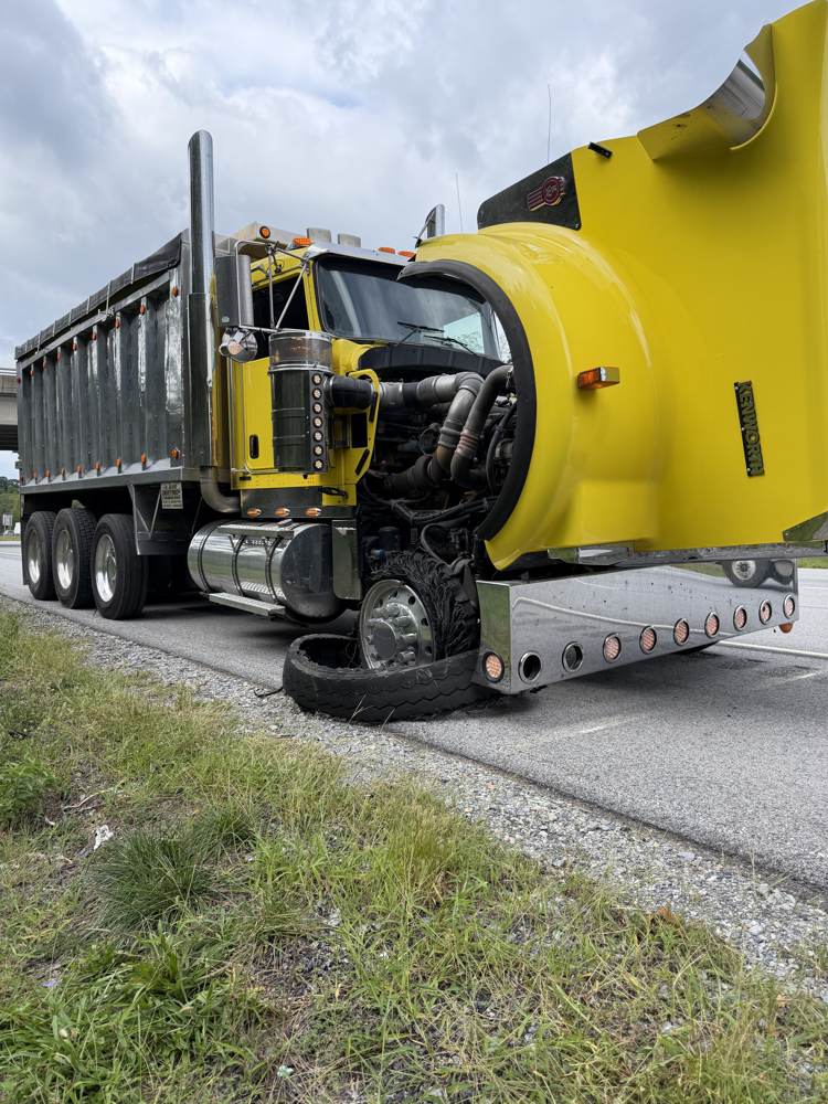 Blown tire on a Kenworth dump truck fixed roadside in south central PA