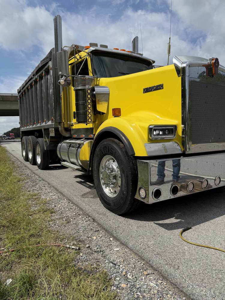 Kenworth dump truck back on the road after a roadside tire call
